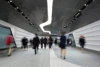 Inner City Business Workers walking through a futuristic tunnel